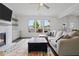 Inviting living room features a fireplace and plenty of natural light at 1998 Lakeview Bend Way, Buford, GA 30519