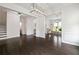 Open concept living area with dark hardwood floors, recessed lights, and elegant trim at 1998 Lakeview Bend Way, Buford, GA 30519