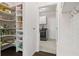Walk-in pantry with ample shelving for organized storage at 1998 Lakeview Bend Way, Buford, GA 30519