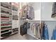 Organized walk-in closet with shelves and rods, offering ample storage solutions at 1998 Lakeview Bend Way, Buford, GA 30519