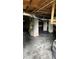 Unfinished basement with plastic ground cover and concrete columns at 2786 Knollview Dr, Decatur, GA 30034