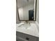 Bathroom features a modern vanity with waterfall faucet and a large mirror at 2786 Knollview Dr, Decatur, GA 30034