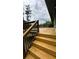 Wooden deck with new stairs and black railings at 2786 Knollview Dr, Decatur, GA 30034