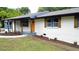 Charming brick home with updated windows, shutters, and a bright front door at 2786 Knollview Dr, Decatur, GA 30034