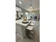 Stylish eat-in kitchen features stainless appliances, and an island with white stools at 2786 Knollview Dr, Decatur, GA 30034