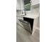 Modern white dishwasher installed with white marble countertop and white cabinets at 2786 Knollview Dr, Decatur, GA 30034
