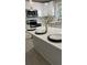 Kitchen with white cabinets, stainless steel appliances, and quartz countertops at 2786 Knollview Dr, Decatur, GA 30034