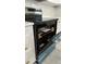 Modern range oven and cooktop with stainless steel finish and white cabinets at 2786 Knollview Dr, Decatur, GA 30034