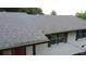 Roof with grey shingles on a white brick house with dark trim at 2786 Knollview Dr, Decatur, GA 30034