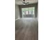 Bright sun room with large bay windows and light wood flooring at 2786 Knollview Dr, Decatur, GA 30034