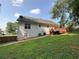 A large, grassy backyard with a deck at 296 Hayes Trce, Hiram, GA 30141