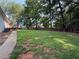 Spacious backyard with a well-maintained lawn and a wooden fence at 296 Hayes Trce, Hiram, GA 30141