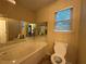 Bathroom with a tub and window that provides natural light at 296 Hayes Trce, Hiram, GA 30141