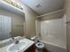 Clean bathroom featuring a shower-tub combo, single sink vanity, and updated fixtures at 296 Hayes Trce, Hiram, GA 30141