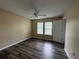 Inviting bedroom with wood floors, double windows, and a ceiling fan at 296 Hayes Trce, Hiram, GA 30141