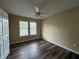 Cozy bedroom with wood floors, natural light, and a ceiling fan at 296 Hayes Trce, Hiram, GA 30141