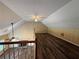 Open-concept bonus room with hardwood floors and a fireplace at 296 Hayes Trce, Hiram, GA 30141