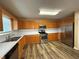 Well-lit kitchen featuring stainless steel appliances, ample counter space, and wood cabinets at 296 Hayes Trce, Hiram, GA 30141
