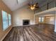 Spacious living room with high ceilings, a cozy fireplace, and lots of natural light at 296 Hayes Trce, Hiram, GA 30141