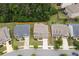 Beautiful home with a well-maintained lawn, nestled between neighboring homes, showing neighborhood context at 406 Fernstone Dr, Canton, GA 30114