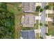 Aerial view of a well-maintained home with a backyard, trees, and a view of the neighborhood streets at 406 Fernstone Dr, Canton, GA 30114