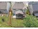 Aerial view of home showcasing large, fenced yard, covered patio, and proximity to neighboring houses at 406 Fernstone Dr, Canton, GA 30114