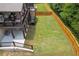 Fenced backyard with covered deck and patio leading to a large, well-maintained lawn at 406 Fernstone Dr, Canton, GA 30114