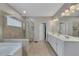 Bright bathroom featuring a tiled shower, soaking tub, and double vanity with great lighting at 406 Fernstone Dr, Canton, GA 30114