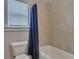 Bathroom featuring a shower with a blue shower curtain at 406 Fernstone Dr, Canton, GA 30114