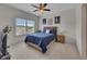 Comfortable bedroom with natural light, a ceiling fan, and stylish decor at 406 Fernstone Dr, Canton, GA 30114