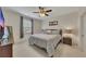 Comfortable bedroom with a ceiling fan and neutral decor at 406 Fernstone Dr, Canton, GA 30114