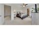 Spacious bedroom with ample natural light, ceiling fan, and adjacent bathroom at 406 Fernstone Dr, Canton, GA 30114