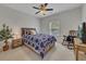 Bedroom featuring large bed, rocking chair, ceiling fan and natural light at 406 Fernstone Dr, Canton, GA 30114