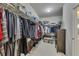 Walk-in closet with shelving for clothes, shoes, and accessories at 406 Fernstone Dr, Canton, GA 30114