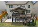 A beautifully designed deck with a covered area, offering comfortable seating and outdoor living space at 406 Fernstone Dr, Canton, GA 30114