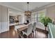 Bright dining room with hardwood floors, wainscoting, and views of the office at 406 Fernstone Dr, Canton, GA 30114