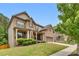 Well-maintained two-story brick home with an attached garage and landscaped yard at 406 Fernstone Dr, Canton, GA 30114