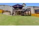 Rear exterior shows upper and lower-level covered outdoor living and well-maintained backyard at 406 Fernstone Dr, Canton, GA 30114