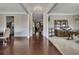 Elegant foyer featuring hardwood floors and open access to the dining room and living spaces at 406 Fernstone Dr, Canton, GA 30114