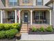 Welcoming front porch featuring rocking chairs, and decorative plants at 406 Fernstone Dr, Canton, GA 30114