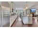 Open concept kitchen features a large island and stainless steel appliances at 406 Fernstone Dr, Canton, GA 30114
