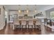 Bright kitchen with a large island, stainless steel appliances, and a dining area, perfect for culinary enthusiasts at 406 Fernstone Dr, Canton, GA 30114
