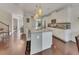 Charming kitchen with an island, modern appliances, granite countertops, and seating, ideal for meal preparation and gatherings at 406 Fernstone Dr, Canton, GA 30114