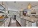 Beautiful kitchen with granite countertops and a view into the living room at 406 Fernstone Dr, Canton, GA 30114
