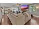 Comfortable living room with a spacious sectional, hardwood floors, and a cozy fireplace, creating a relaxing atmosphere at 406 Fernstone Dr, Canton, GA 30114