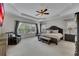 Spacious primary bedroom features tray ceiling and large windows at 406 Fernstone Dr, Canton, GA 30114