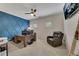 Home office featuring a large desk, recliner, ceiling fan, and custom millwork at 406 Fernstone Dr, Canton, GA 30114