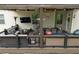 Inviting covered patio featuring comfortable seating, outdoor dining, and a built-in bar area for entertaining at 406 Fernstone Dr, Canton, GA 30114