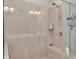Tile and glass walk-in shower with built-in seat and shelving unit at 406 Fernstone Dr, Canton, GA 30114