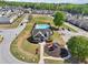 Aerial view of community pool, playground and surrounding townhomes at 4437 Ben Hill Rd, Atlanta, GA 30349